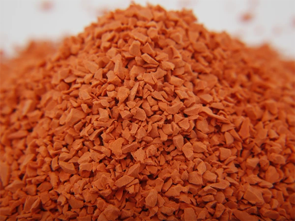 Loose orange EPDM granules