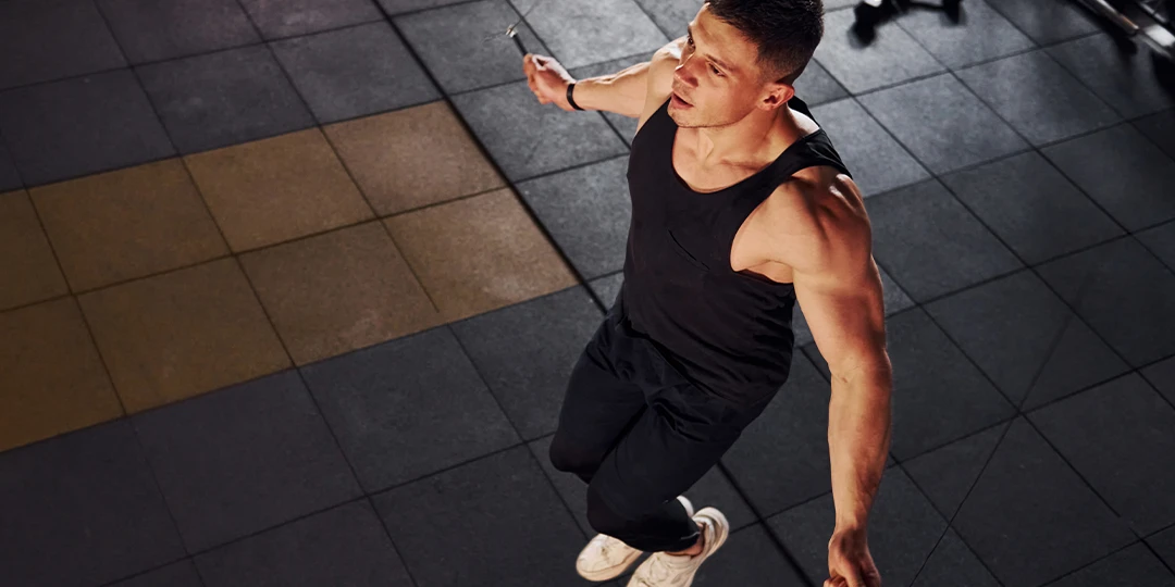 Man skipping rope indoors in the gym